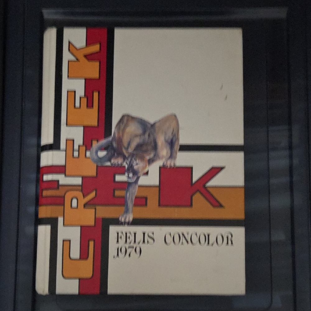 Vintage Creek Yearbook with Animal Illustration
